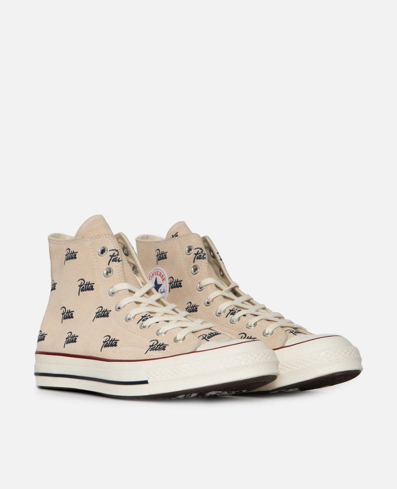 Patta x Converse Chuck 70 Hi sneakers in natural ivory canvas with all-over blue logo print.